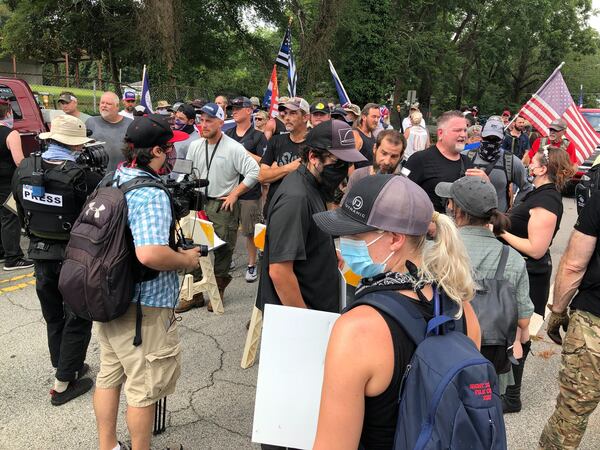 Saturday, Aug. 15, 2020, Stone Mountain -- Counterprotesters and militia members confront one another in Stone Mountain.