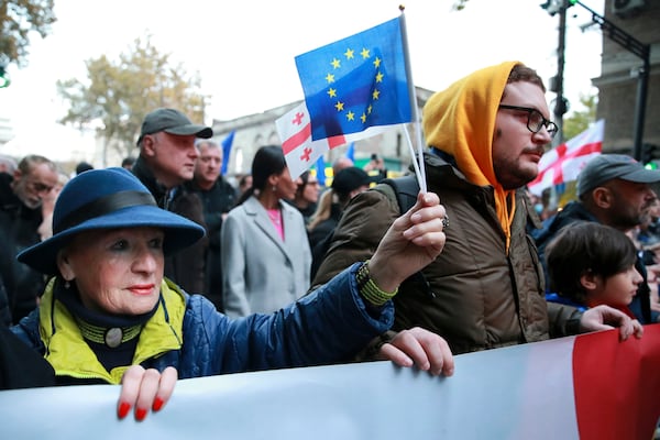 Protesters take part in a rally against alleged violations in a recent parliamentary election in Tbilisi, Georgia, Monday, Nov. 4, 2024. (AP Photo/Zurab Tsertsvadze)