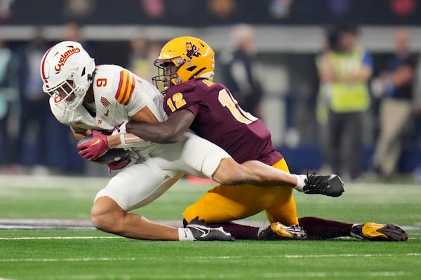 Iowa State wide receiver Jayden Higgins (9) catches a pass as Arizona State defensive back Javan Robinson (12) defends in the second half of the Big 12 Conference championship NCAA college football game, in Arlington, Texas, Saturday Dec. 7, 2024. (AP Photo/Julio Cortez)