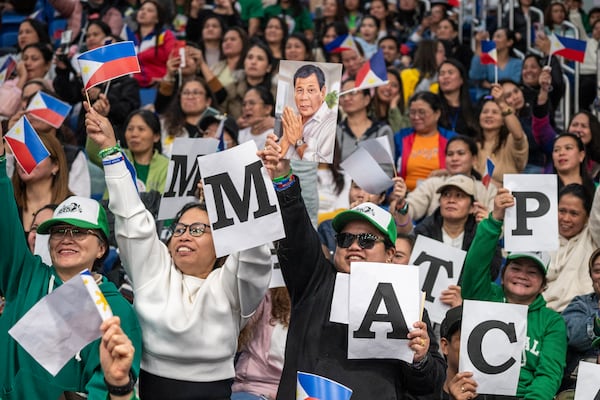 Supporters of former populist President of the Philippines Rodrigo Duterte cheer during a thanksgiving gathering organized by Hong Kong-based Filipino workers for him in Hong Kong on Sunday, March 9, 2025. (AP Photo/Vernon Yuen)