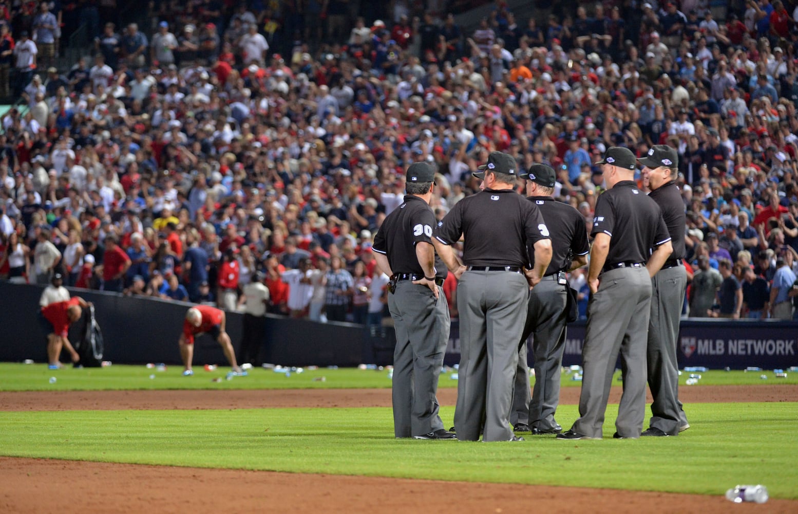 Fans litter field after questionable ruling