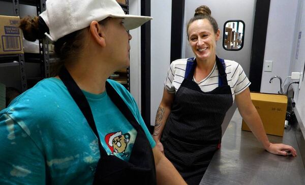 Brittney Espersen, right, the general manager/chef at The Food Mill in Columbus, Georgia, talks with Wendy Smith, an intern at The Food Mill from the Truth Spring Trade School. (Photo Courtesy of Mike Haskey)