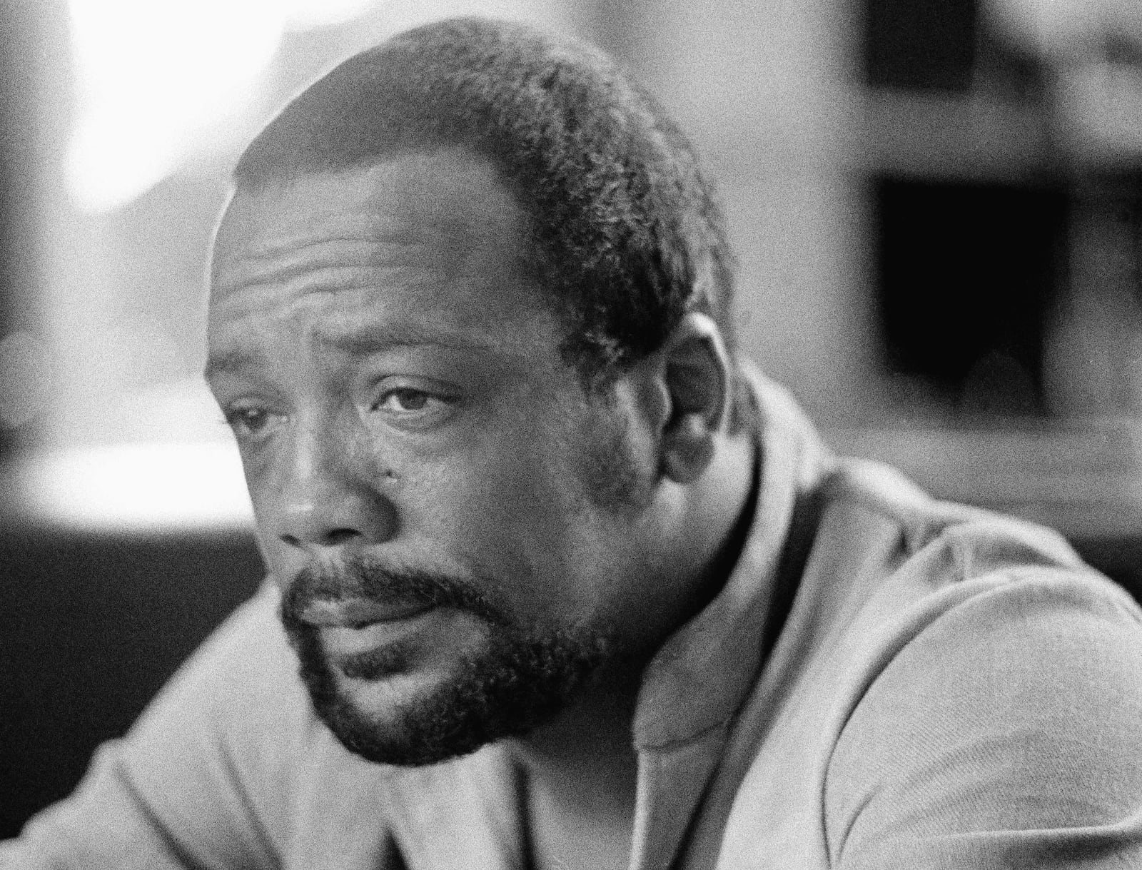 FILE - Quincy Jones, famed composer recovering from recent brain-blood-vessel surgery, relaxes at his Los Angeles music studio on Oct. 16, 1974. Quincy Jones died at age 91. (AP Photo/George Brich, File)