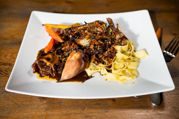  Braised Oxtails with sundried tomato and orange gremolata, pappardelle noodles, and roasted root vegetables. Photo credit- Mia Yakel.