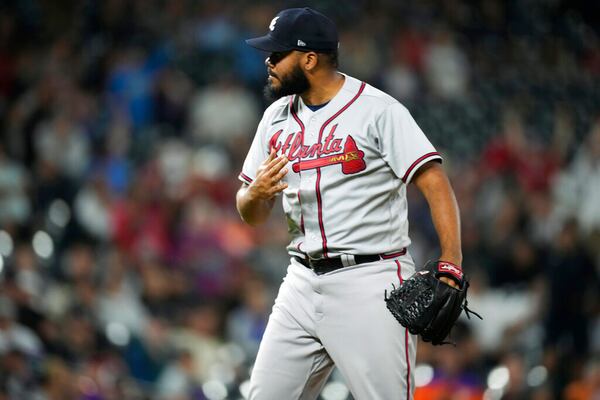 Atlanta Braves relief pitcher Kenley Jansen reacts after striking out Colorado Rockies' Ryan McMahon to end a baseball game Friday, June 3, 2022, in Denver. (AP Photo/David Zalubowski)