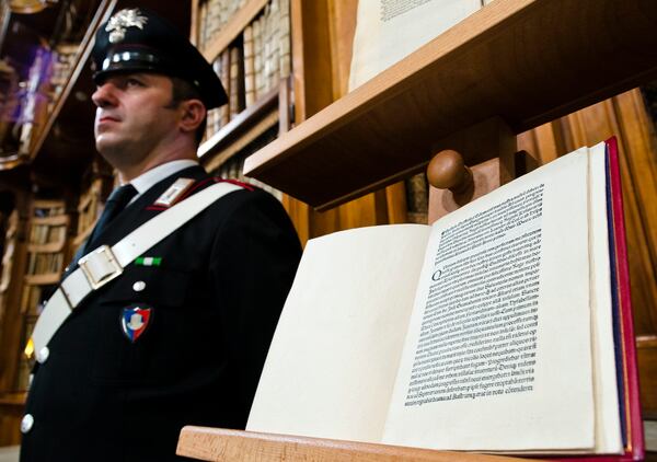 A reprinted copy of Christopher Columbus original letter written in 1493 about the discovery of the New World is displayed during a press conference in Rome, Wednesday, May 18, 2016. The United States has returned to Italy a letter written by Christopher Columbus in 1493 about his discovery of the New World that was stolen from a Florence library and unwittingly acquired by the Library of Congress. (AP Photo/Domenico Stinellis)