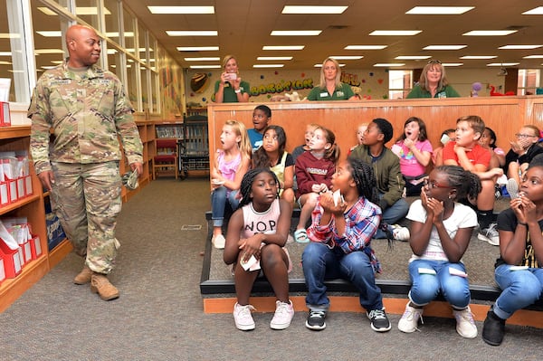 You can see the surprise on the face of Andrew Benjamin's daughter as he walks in to surprise her and her class Friday.