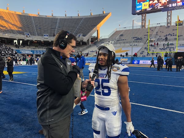 Georgia State running back Freddie Brock talks to GSU radio analyst Harper LeBel after his record-setting running performance in the Famous Idaho Potato Bowl, Dec. 23-, 2023, in Boise, Idaho.