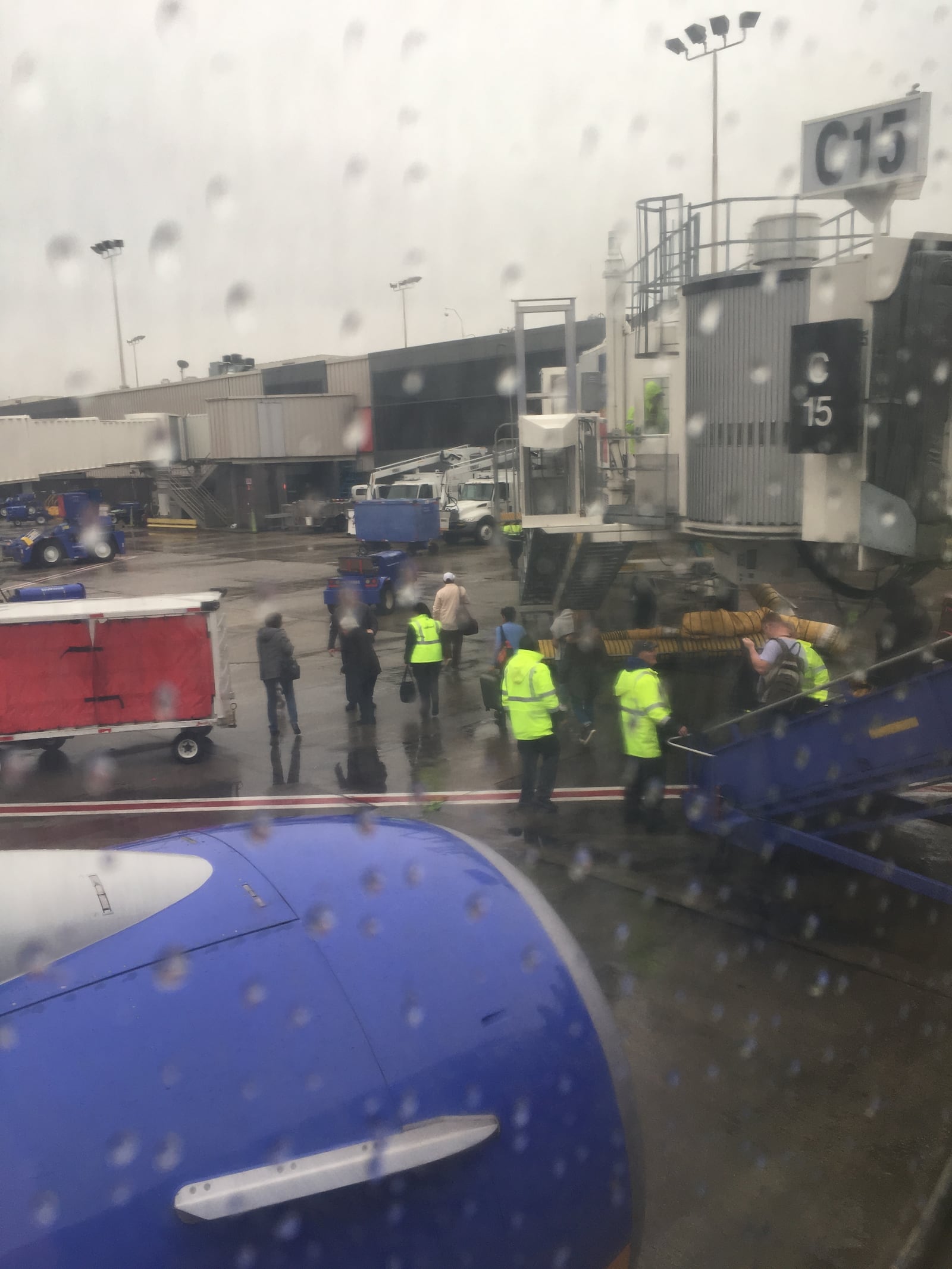 A flight parked at the airport lets passengers off by ladder. (Credit: Rick Crotts / Rickie.Crotts@AJC.com)