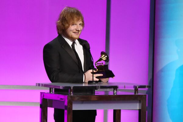 Ed Sheeran accepts the award for best pop solo performance for Thinking Out Loud at the 58th annual Grammy Awards on Monday, Feb. 15, 2016, in Los Angeles. (Photo by Matt Sayles/Invision/AP)