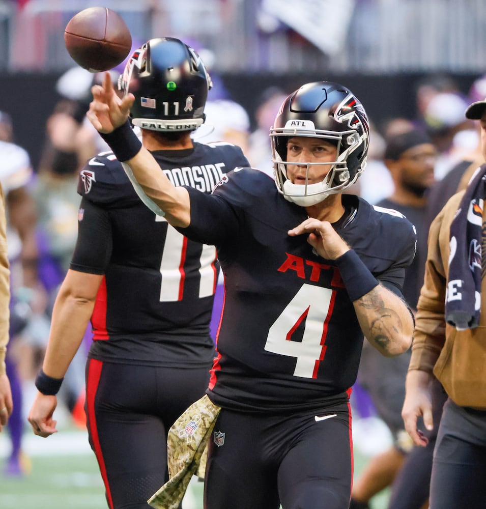 Atlanta Falcons quarterback Taylor Heinicke (4) warms up before an NFL football game In Atlanta on Sunday, Nov. 5, 2023 between the Atlanta Falcons and the Minnesota Vikings. (Bob Andres for the Atlanta Journal Constitution)