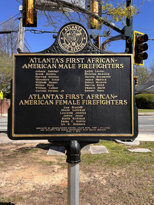 The plaque, located outside of Station 16, shows all the names of the men and women who integrated the fire department.