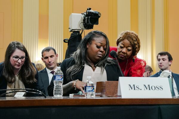 Shaye Moss (center) is being comforted by her mother, Ruby Freeman, as she testifies in a House committee hearing in Washington on Tuesday, June 21, 2022. Rudy Giuliani was ordered to pay Moss and Freeman $148 million. (Shuran Huang/NYT 2022)
                      