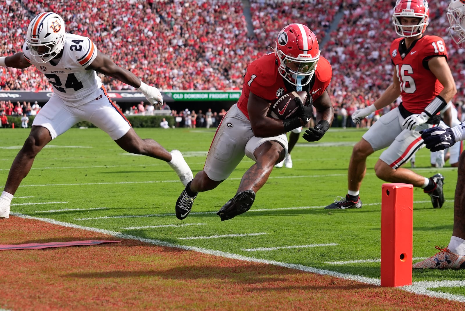 Georgia running back Trevor Etienne (1) is forced out of bounds by Auburn's Keyron Crawford (24) short of the end zone after making a catch in the first half of an NCAA college football game Saturday, Oct. 5, 2024, in Athens, Ga. (AP Photo/John Bazemore)