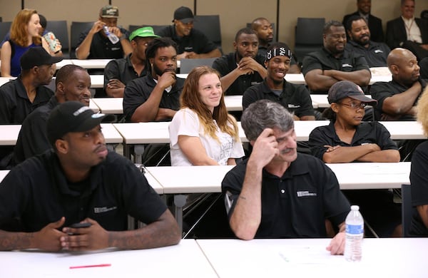 Empire Distributors employees attend a recent personal financial wellness event at the company in Atlanta. Curtis Compton/ccompton@ajc.com