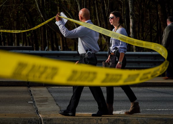 Investigators arrive on the scene of an officer-involved shooting on Chastain Road. 