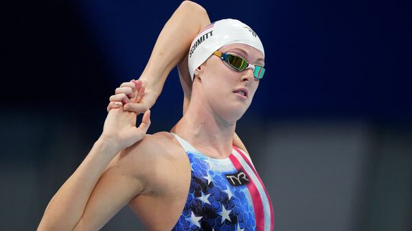 Allison Schmitt of the United States stretches ahead of swim in a heat of the women's 200-meter freestyle at the 2020 Summer Olympics, Monday, July 26, 2021, in Tokyo, Japan. (Matthias Schrader/AP)