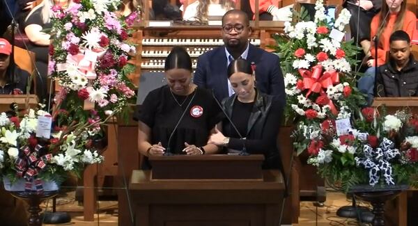 Logen Reed (left) and Angela Kirkpatrick speak about their former UGA colleague Chandler LeCroy at her funeral Wednesday afternoon.