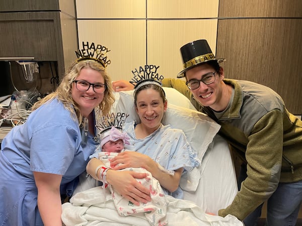 Lily Clayton was the first baby born at Piedmont Athens Regional Hospital in 2025, to mom Abigail Clayton and dad Zach Clayton (right) from Athens. Nurse Michaela Thomas (left) assisted with the birth. (Courtesy of Piedmont Athens Regional Hospital)