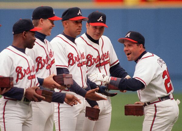 Opening Day 1996: Braves second baseman Mark Lemke (right) celebrates with teammates (l-r) Marquis Grissom, Chipper Jones, David Justice and Ryan Klesko upon receiving his 1995 World Series championship ring on April 1, 1996.