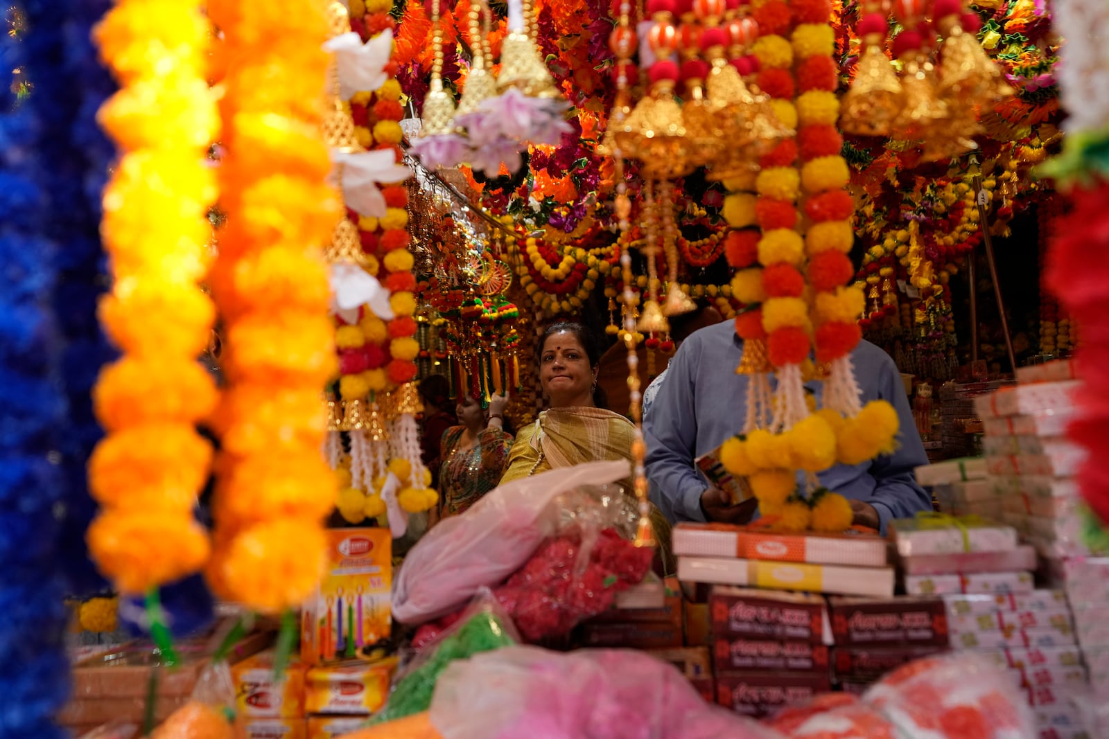 Women shop on the eve of Diwali, the Hindu festival of lights, in Jammu, India, Wednesday, Oct. 30, 2024.Diwali is one of Hinduism's most important festivals, dedicated to the worship of the goddess of wealth Lakshmi. (AP Photo/Channi Anand)