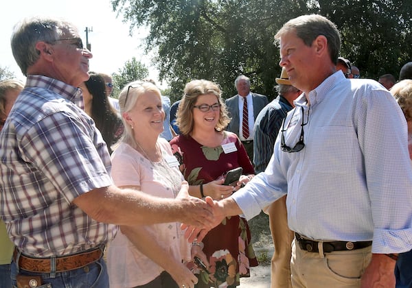 Republican candidate for governor Brian Kemp makes the rounds, greeting supporters, at a fish fry and rally at Griff Bowen’s Fish House in Rhine on Oct. 4. It was the third stop of the day on Kemp campaign trail, where hundreds of supporters gathered to hear the candidate speak. (RYON HORNE / RHORNE@AJC.COM)