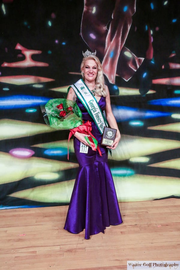 Autumn-Skye Boothe of Roswell, the reigning Ms. Fulton County Forestry, won the 2021 Ms. Georgia Forestry title over the last weekend in June in Tifton, Georgia. She is the wife of Carl Boothe and mother to Dr. Alanna Port. In addition to winning the crown she won the Fun Fashion portion of the event in a dress she designed herself.