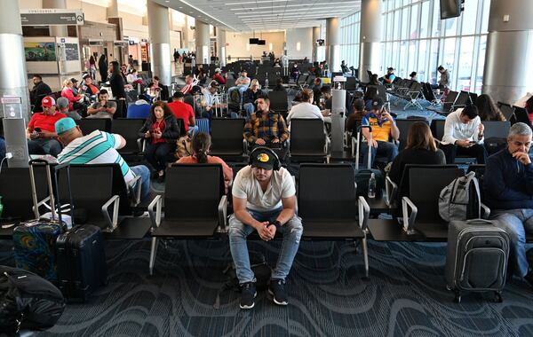 April 29, 2022 Atlanta - International travelers wait to board a flight in Maynard H. Jackson Jr. International Terminal on Friday, April 29, 2022. (Hyosub Shin / Hyosub.Shin@ajc.com)