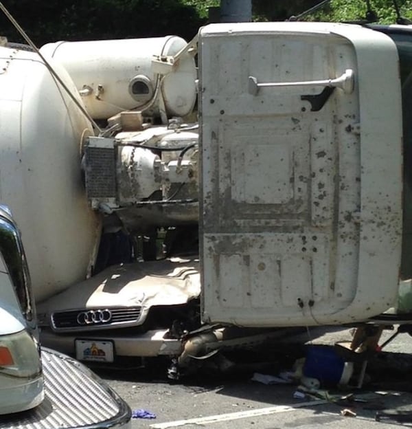 In May 2015, a cement truck went through a red light at the intersection of North Decatur Road and Superior Avenue, skidded and fell onto a car. The auto's driver survived. Photo courtesy of Decaturish and Mike Hall