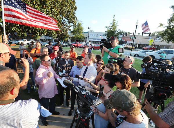 September 13, 2016 COVINGTON Chris Hill, commanding officer of the III% Georgia Security Force, speaks to the news media during a protest against building a mosque in Newton County held on the town square, Tuesday, Sept. 13, 2016, in Covington. Curtis Compton /ccompton@ajc.com