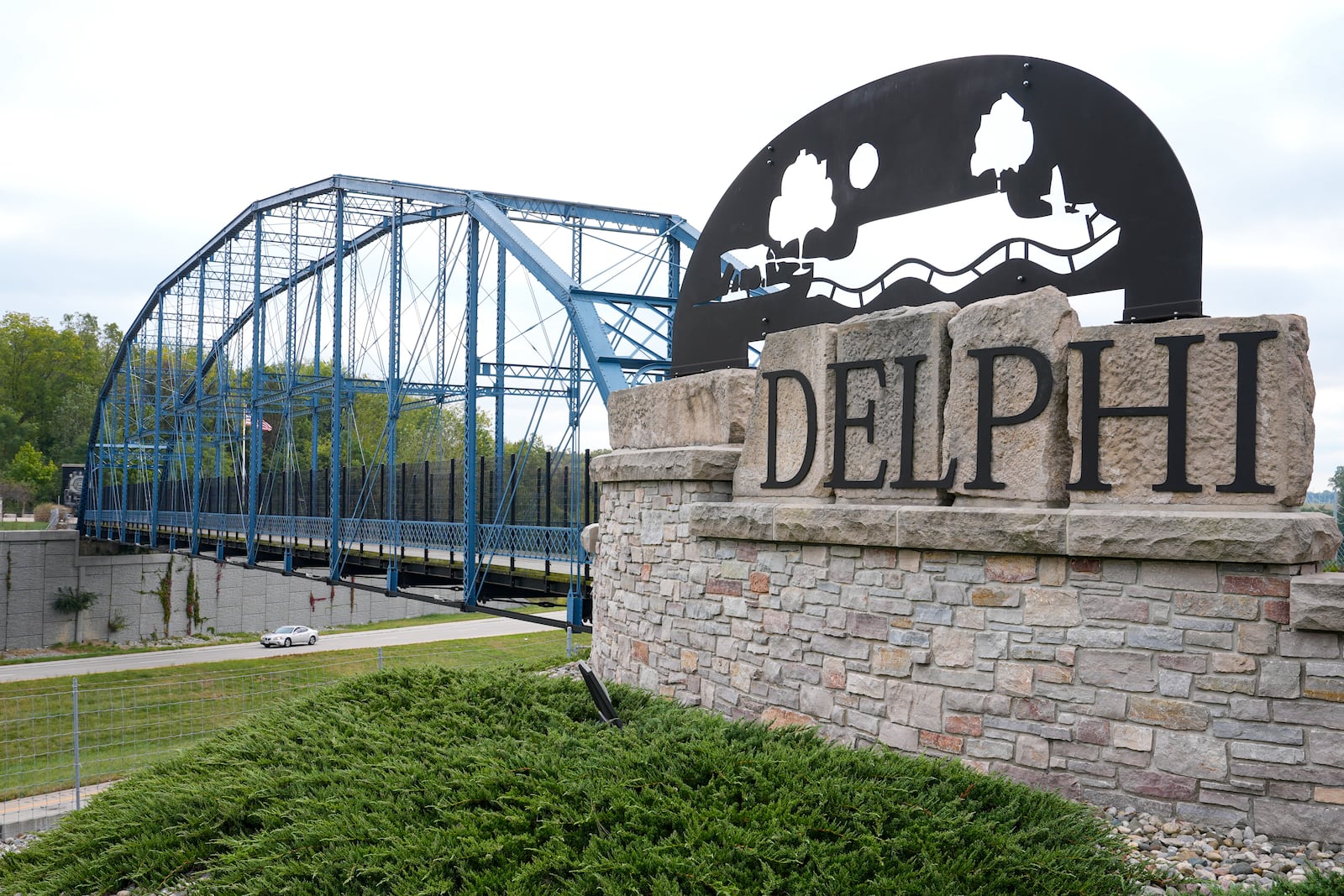 A sign announcing the town of Delphi, Ind., along Indiana State Road 25 is shown Tuesday, Oct. 1, 2024. (AP Photo/Michael Conroy)