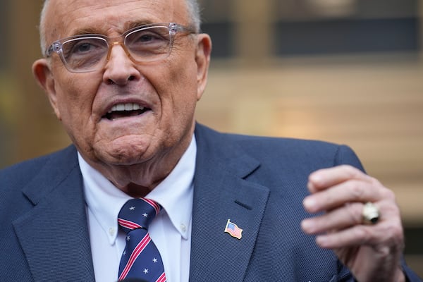 Rudy Giuliani speaks to reporters as he leaves the federal courthouse in New York, Tuesday, Nov. 26, 2024. (AP Photo/Seth Wenig)