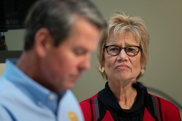 Dr. Kathleen Toomey, Georgia’s public health commissioner, listens as Gov. Brian Kemp answers a question during a news conference Wednesday. Kemp extended a shelter-at-home order to deal with the coronavirus pandemic through the rest of April. Ben@BenGray.com for The Atlanta Journal-Constitution