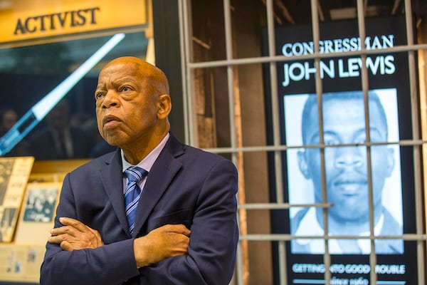 The late U.S. Congressman John Lewis, D-Ga., poses for a portrait in front of his newly unveiled art exhibit "John Lewis-Good Trouble" in the atrium of the domestic terminal at Atlanta's Hartsfield Jackson International Airport, on April 8, 2019. (Alyssa Pointer/Atlanta Journal-Constitution/TNS)