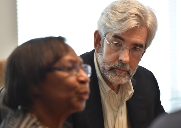 August 15, 2018 Atlanta - Mary Ingram, former employee with Buford City Schools, speaks as her attorney Edward Buckley looks at Buckley Beal law office on Wednesday, August 15, 2018. HYOSUB SHIN / HSHIN@AJC.COM