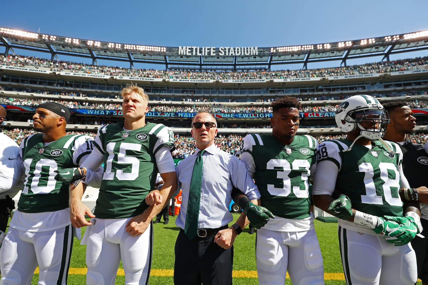 Photos: Falcons show solidarity during National Anthem