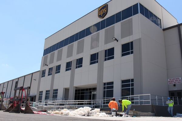 Employees work on finishing the construction at UPS’ new southeast ground hub on the west side of Atlanta on Monday, July 9.