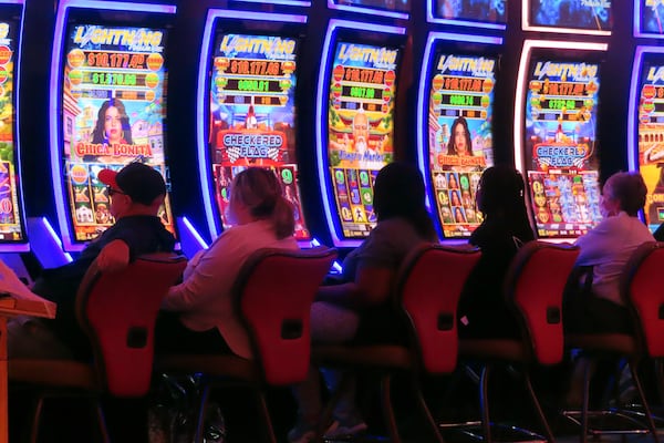 Gamblers play slot machines at the Hard Rock casino in Atlantic City, N.J., on Oct. 3, 2024. (AP Photo/Wayne Parry)