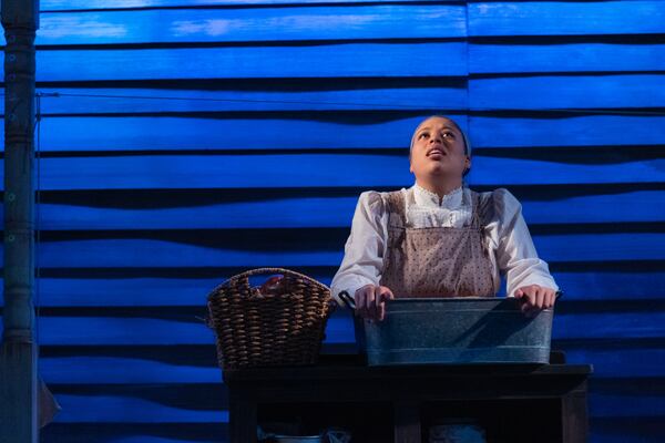 One of the washerwomen, played by Kenedi Deal, despairs over unfair work conditions in the Fourth Ward. Courtesy of Casey Gardner Ford