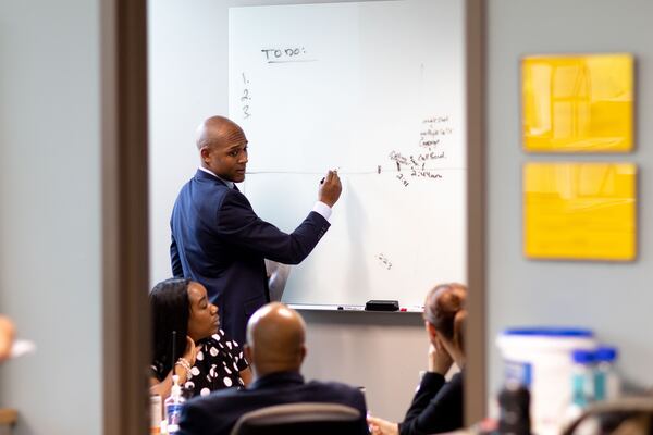 Atlanta Police Department Homicide Commander Lt. Ralph Woolfolk goes over the timeline of an ongoing investigation with members of the homicide unit at Atlanta Public Safety Headquarters on Tuesday, April 5, 2022, in Atlanta. Branden Camp/For the Atlanta Journal-Constitution