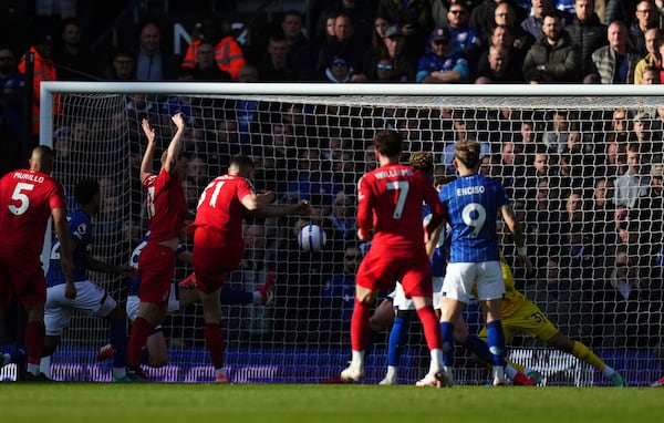 Nottingham Forest's Nikola Milenkovic scores their side's first goal of the game during the English Premier League soccer match between Ipswich Town and Nottingham Forest at Portman Road, Ipswich, England, Saturday March 15, 2025. (John Walton/PA via AP)