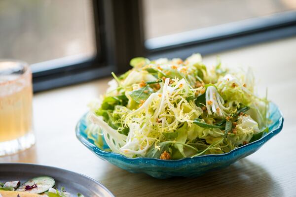 Redbird garden greens with simple vinaigrette, garlic crumbs and chives. Photo credit- Mia Yakel.