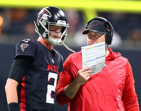 Falcons head coach Arthur Smith and Matt Ryan confer during a timeout against the Buccaneers in a NFL football game on Sunday, Dec 5, 2021, in Atlanta.   “Curtis Compton / Curtis.Compton@ajc.com”`