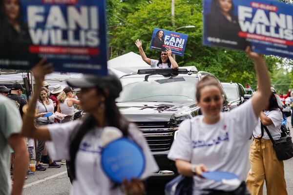 Fulton County District Attorney Fani Willis rides in a car while participating in the Inman Park Parade on Saturday, April 27, 2024, in Atlanta. (Elijah Nouvelage for The Atlanta Journal-Constitution)