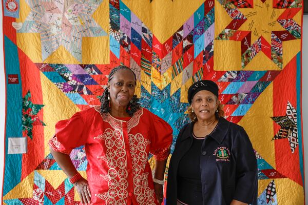 Alcelia Scott-Ford (left) embroidered hundreds of names onto  Stockbridge's centennial quilt, whose creation was overseen by Aisha Lumumba (right). (Natrice Miller/ Natrice.miller@ajc.com)