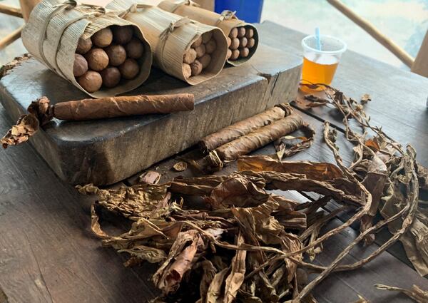 "We returned (last winter) from Cuba and while there we traveled to an area (Vinales) where tobacco is grown," wrote John Poole. "They taught us about the farming methods, the tobacco plants and methods for rolling (and smoking) Cuban cigars.  This is a picture from one of the local farms that is located in a UNESCO World Heritage area where only natural, non-mechanized farming methods can be utilized for the growing and harvesting of the tobacco."