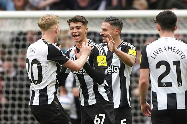 Newcastle United's Lewis Miley, second left, celebrates scoring with teammates during the English Premier League soccer match between Newcastle United and Nottingham Forest at St James' Park, Newcastle upon Tyne, England, Sunday, Feb. 23, 2025. (Owen Humphreys/PA via AP)