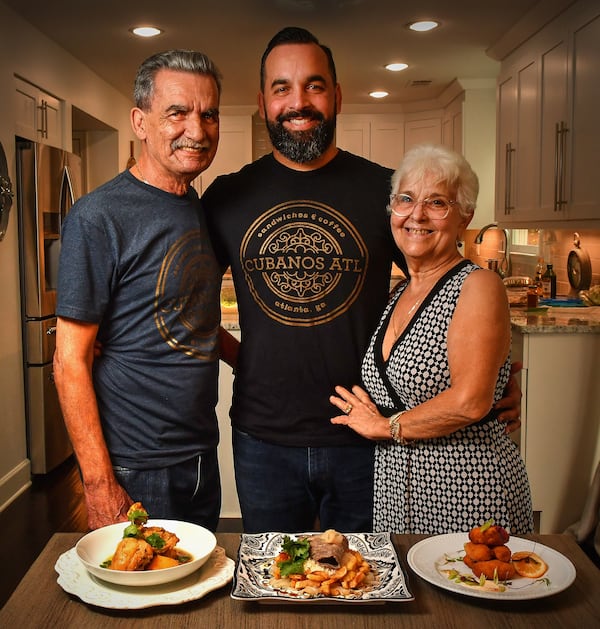 Ozzy Llanes is seen with his father, Osvaldo (left), and his mother, Amy. Chris Hunt for The Atlanta Journal-Constitution 