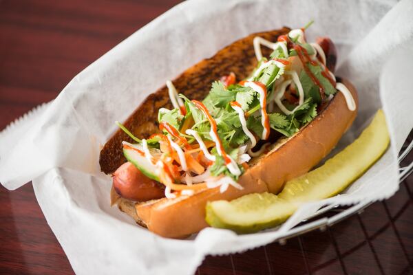 Banh Mi Dog with cucumber, pickled daikon radish, carrot, cilantro, mayo, and Sriracha. Photo credit- Mia Yakel.