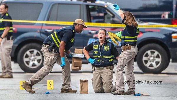 GBI and Atlanta police investigators are on the scene of an officer-involved shooting in downtown Atlanta in June.